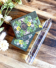 Load image into Gallery viewer, Terra Lenormand closed tuck box sitting on top of stacked deck of cards and lying next to a crystal on a wood background