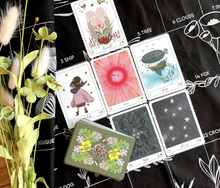 Load image into Gallery viewer, A spread using the Terra Lenormand cards on the grand tableau cloth and the rest of the deck stacked below