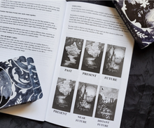 Load image into Gallery viewer, The Endless oracle cards stacked facedown on the open guidebook