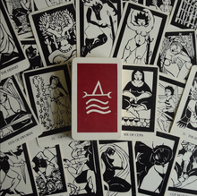 Load image into Gallery viewer, Thea's Tarot back of card design at the center on top of a selection of front facing cards