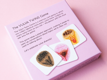 Load image into Gallery viewer, Back of the Vulva Twins game box on a pink background