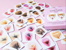 Load image into Gallery viewer, Vulva Twins game box sitting on top of game cards facing up on a pink background