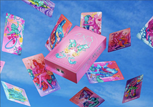 Load image into Gallery viewer, Zeke's Arcana box surrounded by floating cards on a blue sky-like background