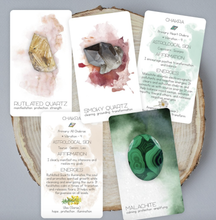 Load image into Gallery viewer, Radiant Crystal Cards 2nd edition 5 cards laying on a cut wood plate 
