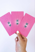 Load image into Gallery viewer, Hand holding 3 Zeke&#39;s Arcana cards fanned out with the backs showing on a white background
